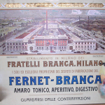 Fig. 16. «Veduta del nuovo stabilimento Branca, a Milano», 1906 circa, olio e stampa tipografica su legno (Museo storico Branca, Milano)